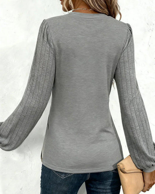 Svītraina blūze ar pufētām piedurknēm