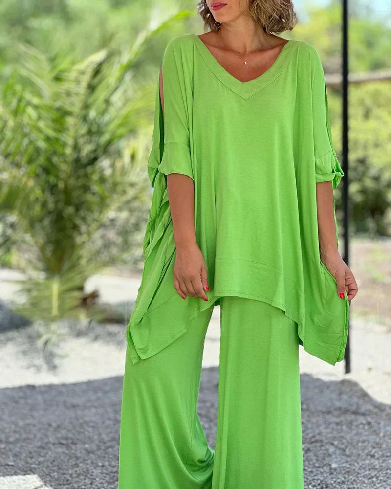 Brīvā divdaļīga kostīma ar plašām biksēm