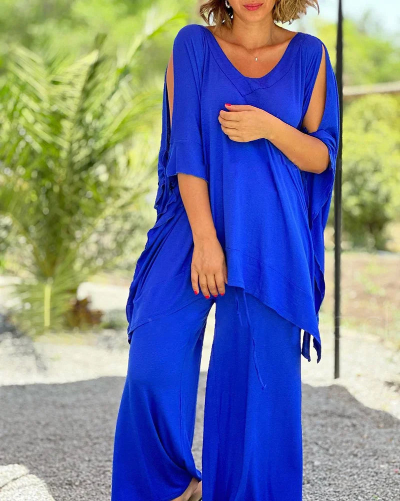 Brīvā divdaļīga kostīma ar plašām biksēm