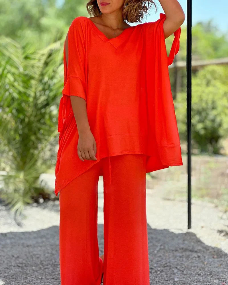 Brīvā divdaļīga kostīma ar plašām biksēm