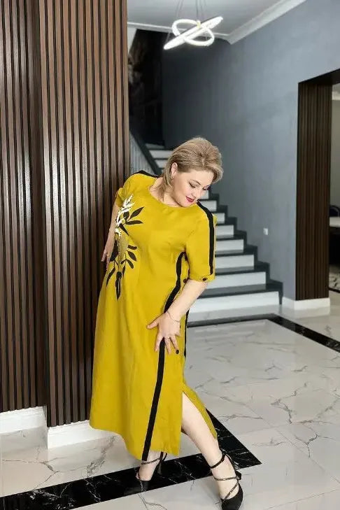 Dzeltena kleita, rotāta ar ziedu