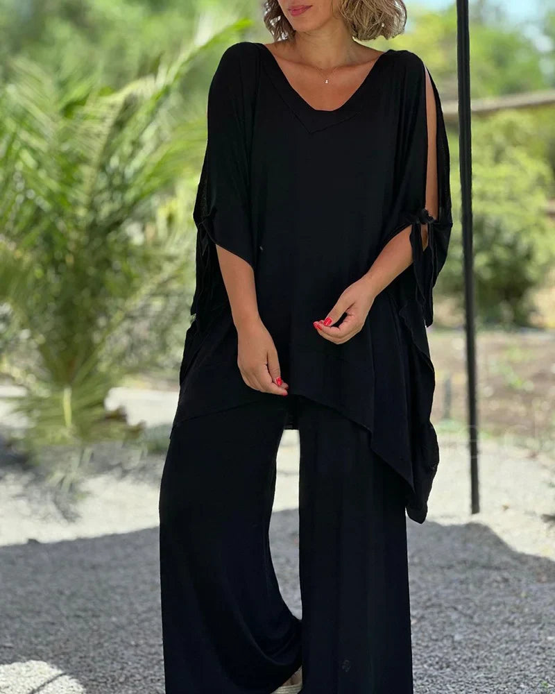 Brīvā divdaļīga kostīma ar plašām biksēm